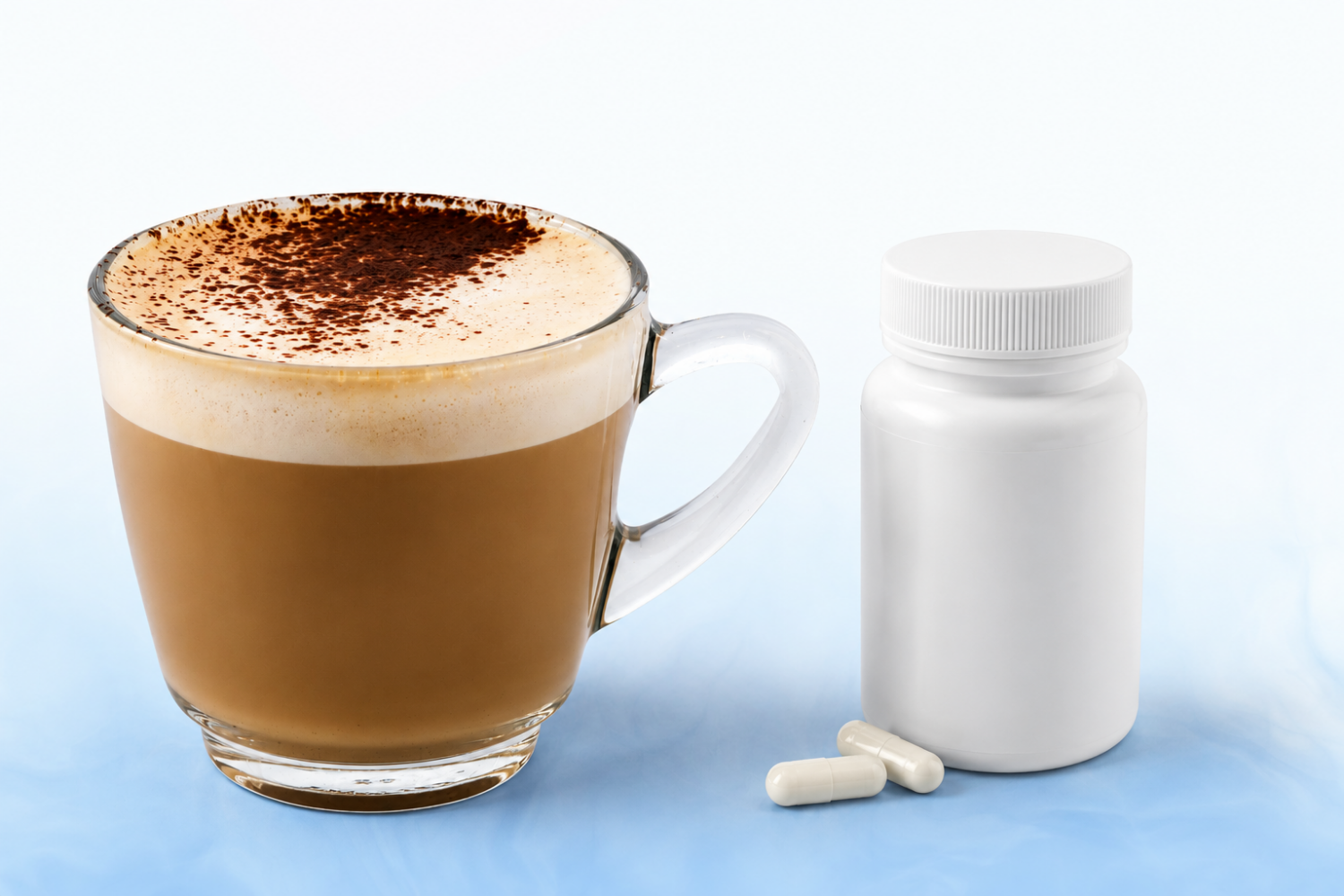 Cup of coffee beside an unbranded supplement bottle and white capsules, comparing energy supplements vs. coffee for longer-lasting energy.