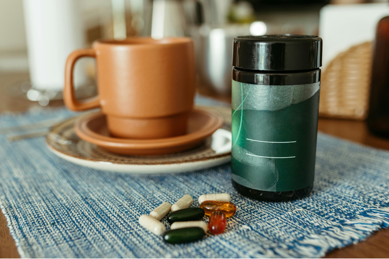 Green tea extract supplement bottle with capsules beside a cup of tea