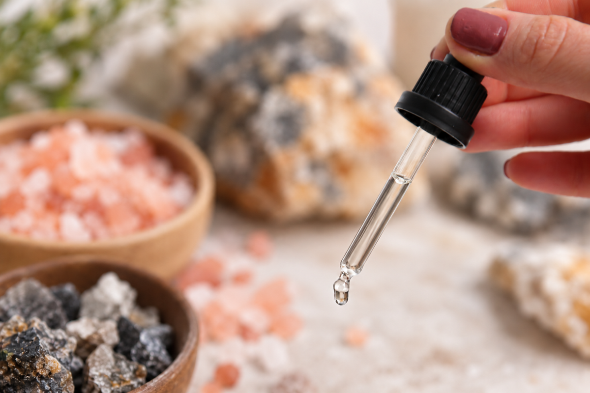 Dropper with liquid mineral supplement and natural mineral stones