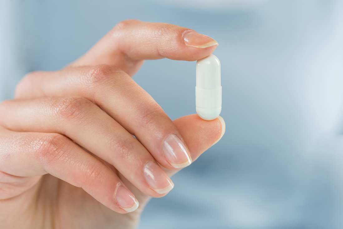 A person holding lithium orotate 5mg