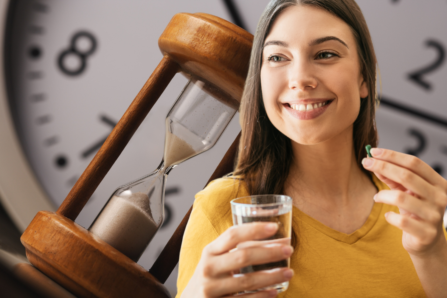 Woman holding a capsule and glass of water beside an hourglass and clock.