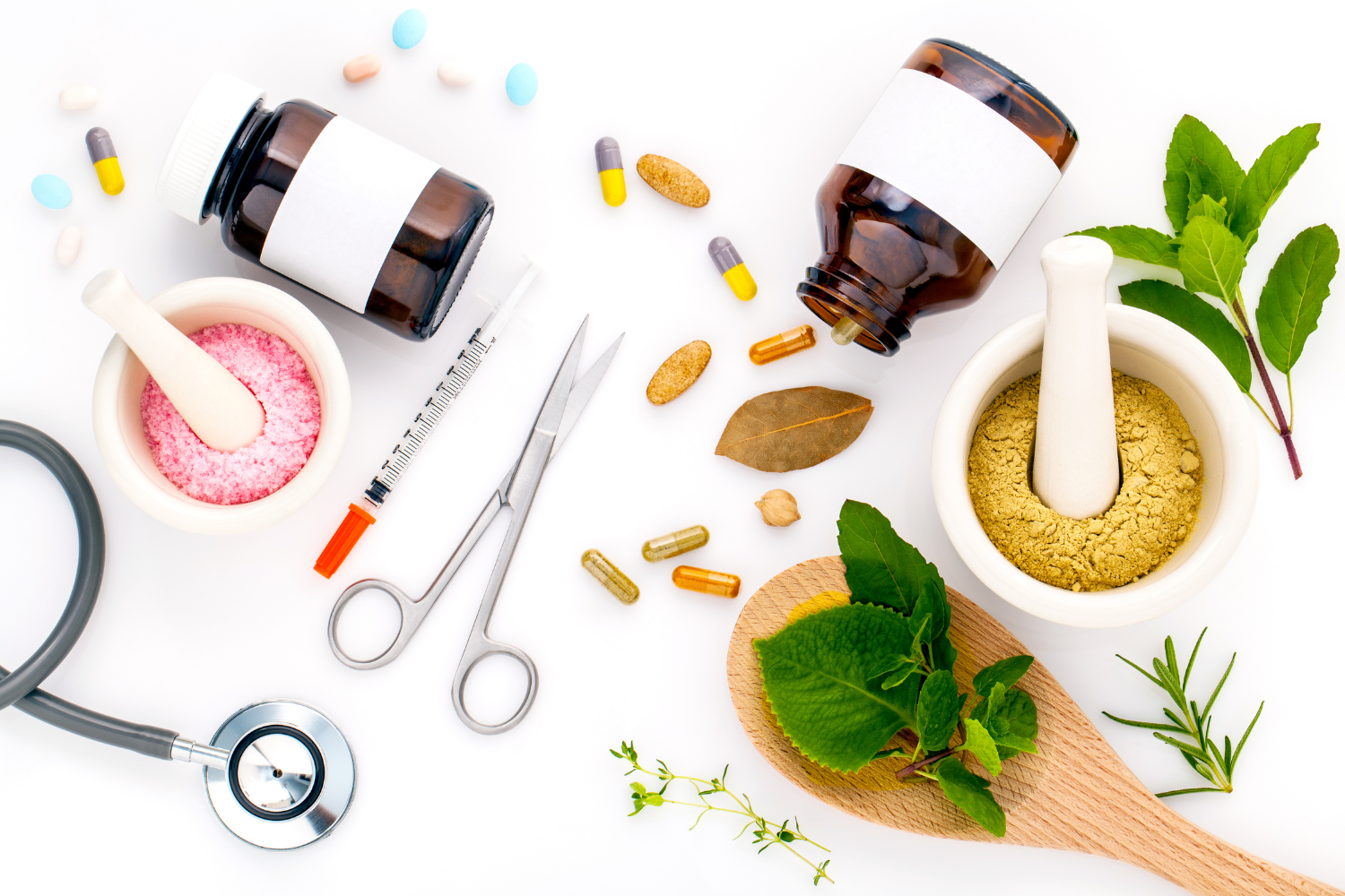  Supplements, herbs, a stethoscope, and medical tools arranged on a white background
