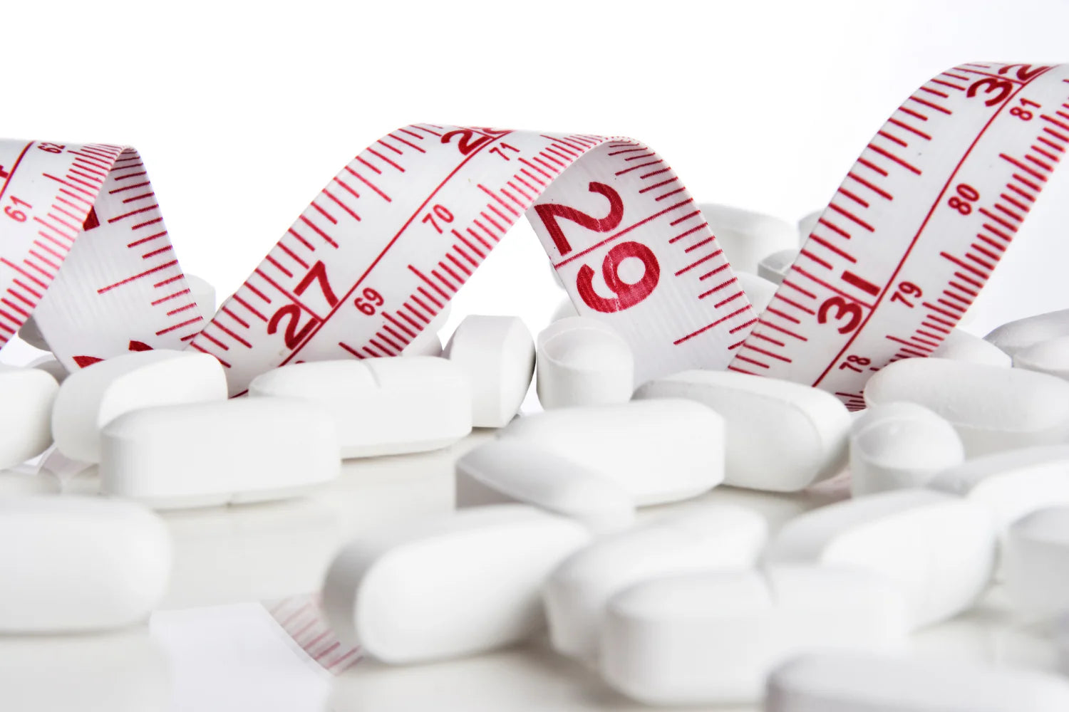 Measuring tape used for tracking weight loss behind lithium orotate supplements